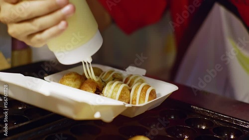 Vendor Preparing Takoyaki with Sauce and Seaweed – 4K 60fps Close-Up in Chiang M