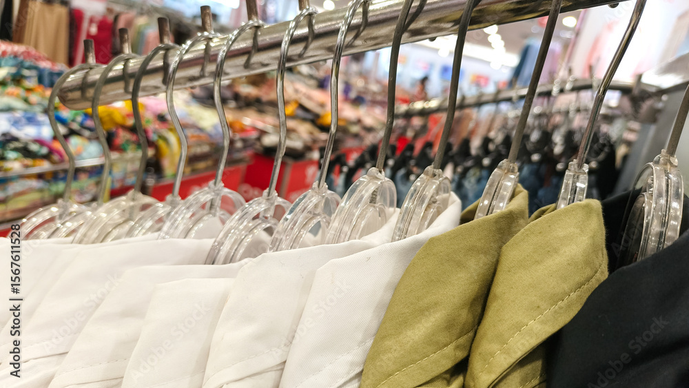 Fototapeta premium Clothing racks filled with various garments.