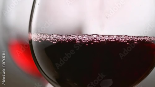 Close-Up of Red Wine Surface with Bubbles in Glass – Elegant Alcoholic Drink Texture