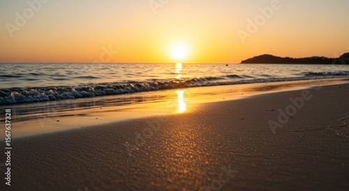 Wallpaper Mural Closeup beach sand with warm sunset sky and panoramic ocean horizon. Calm light and natural textures create a peaceful tropical seascape. Ideal for summer vacation themes and banners. Torontodigital.ca