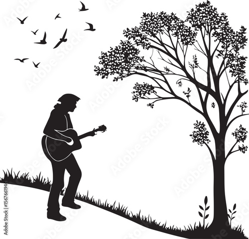 Silhouette of a guitarist playing music beneath a tree with flying birds in the sky