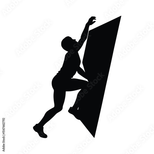 Black silhouette of a climber on a rock wall climbing