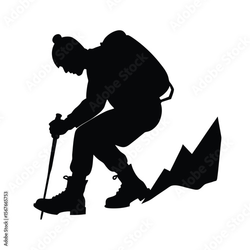 Black silhouette of mountaineer adjusting boot on rocky terrain