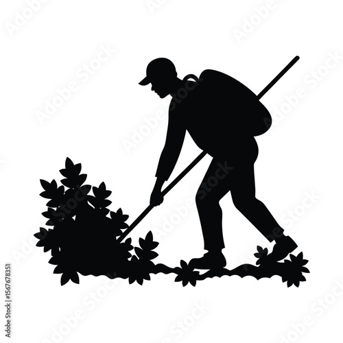 Silhouette of person with backpack clearing bushes with pole