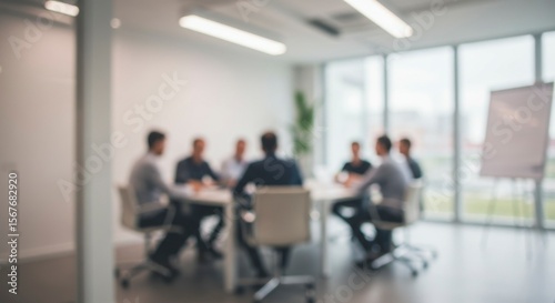 Blurred view of business meeting in modern office