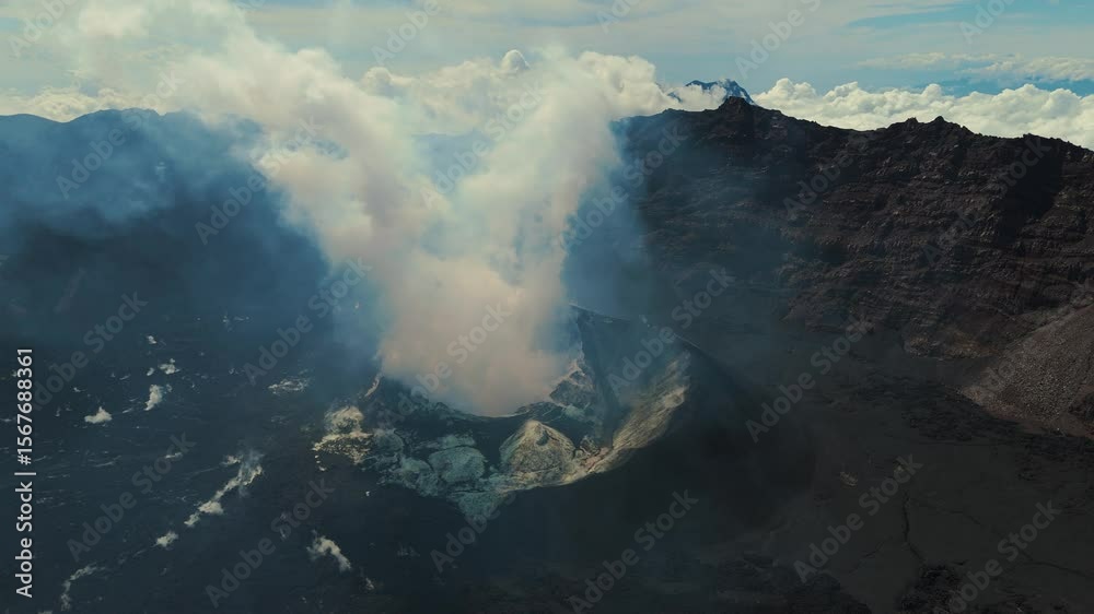 4K drone footage of Mount Raung at sunrise, revealing steep ridges, misty forests, and one of Indonesia’s most extreme hiking trails with cloud and vulcano 