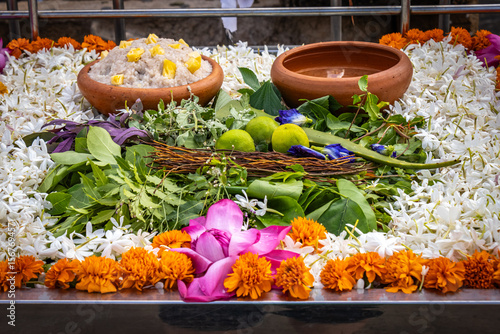 Fotografie Buddhist puja flower offerings including pink lotus and Fragrant Arabian jasmine
