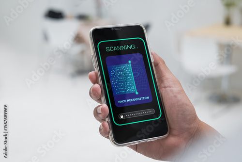 Security system with facial recognition, Face ID. Man unlocks smartphone with biometric identification scan, personal verification.