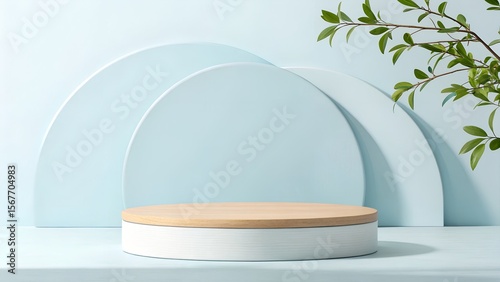 Serene Minimalist Product Display: Light Blue Background, Wooden and White Platform, Greenery Accents
