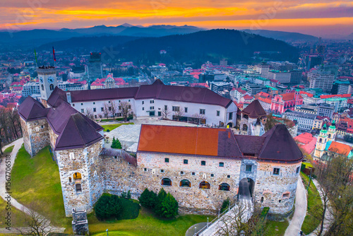 Aerial view of Ljubljana, the capital of Slovenia, showcasing the charming old town with its red rooftops, historic streets, and the iconic sightseeing spot perched on a hill above the city center