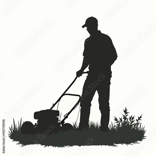 Silhouette of a man mowing a lawn with a push mower.