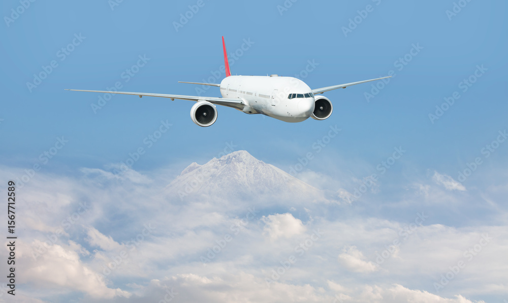 Fototapeta premium An airplane flying over a taurus mountain range, with snow-capped peaks visible below