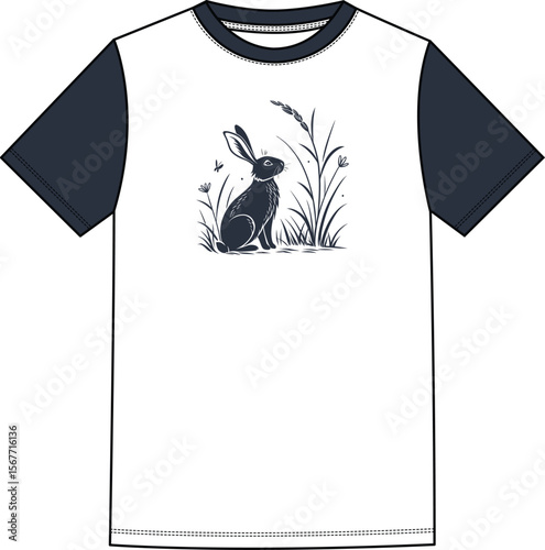 A rabbit sitting calmly near some grass
