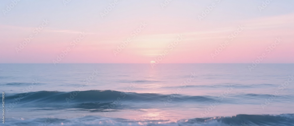 Obraz premium Serene pink sunset paints the ocean
