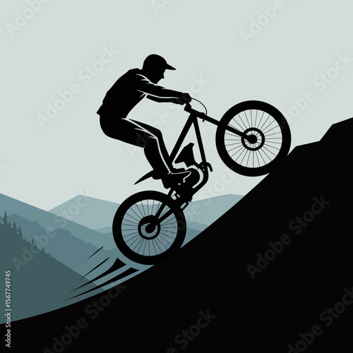 Silhouette of a mountain biker performing a wheelie on a steep incline with layered mountains in the background under a pale sky