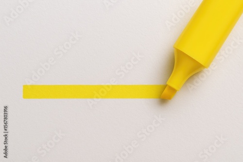 Bright yellow marker emphasizing text on plain paper background