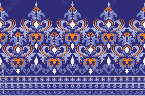 Multi-colored flowers decorate the whole piece, seamless in horizontal style, blue background.