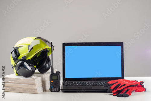 Laptop and helmet of builde...