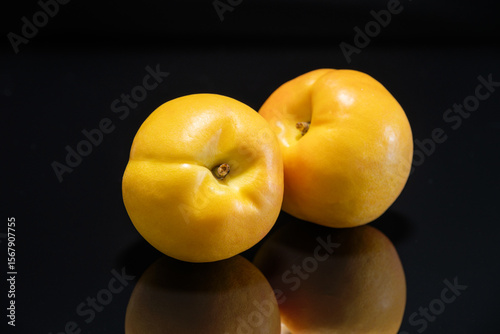 Yellow peach with black background