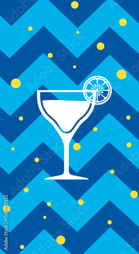 White margarita glass with a lemon slice on a blue zigzag background with colorful dots, festive design, copy space
