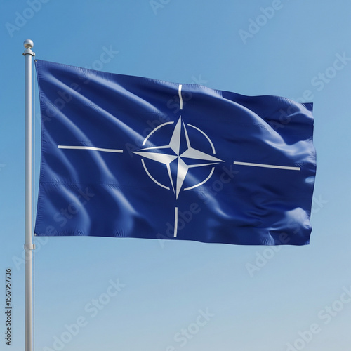 NATO - OTAN flag waving in the wind against a blue sky background