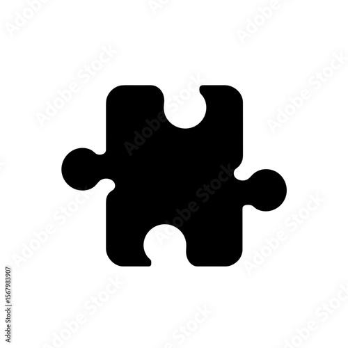 A black puzzle piece with curved edges and connectors stands out against a plain white backdrop, symbolizing unity and problem-solving.