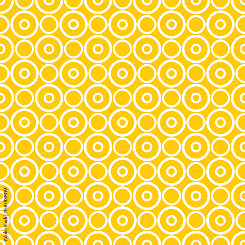 Seamless vector pattern with white polka dots on a sunny yellow background