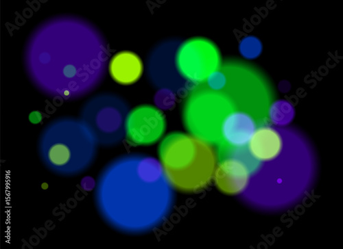 Colorful blurred circles on dark background with smooth soft edges. Overlapping glowing bokeh creates dreamy abstract depth and festive atmosphere without clear focal point.