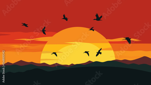 The Graceful Silhouette Of A Flock Of Birds Migrating Across A Vibrant Sunset Sky