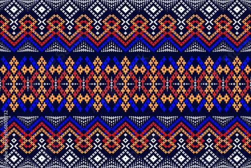 A beautiful traditional woven fabric featuring vibrant geometric patterns on a dark blue background, suitable for textile design and handicrafts.