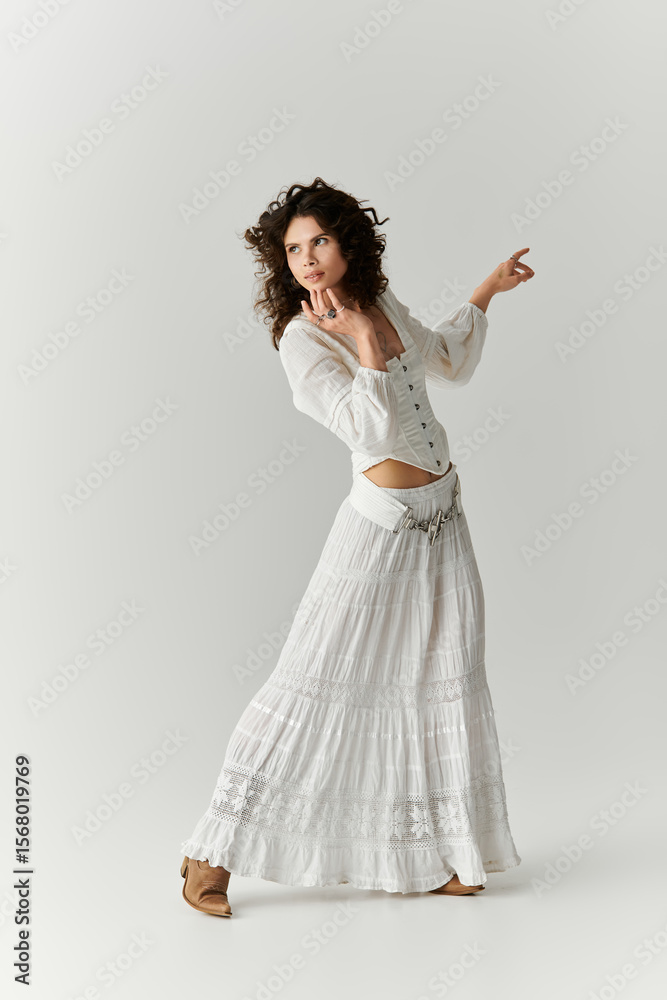 Naklejka premium Stunning young woman showcases unique fashion style in a graceful pose