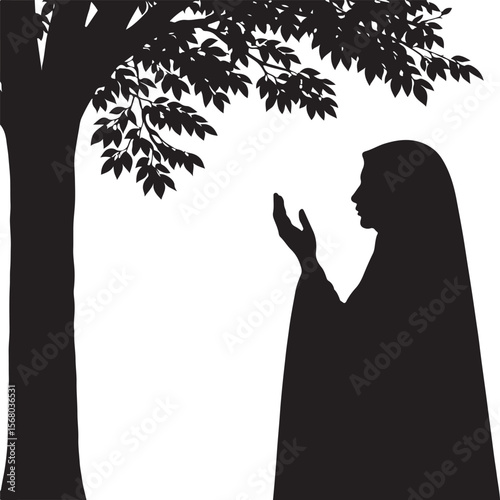 Silhouette of a muslim woman in hijab praying under a tree