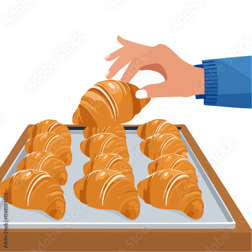 A hand selecting a croissant from a tray of freshly baked pastries