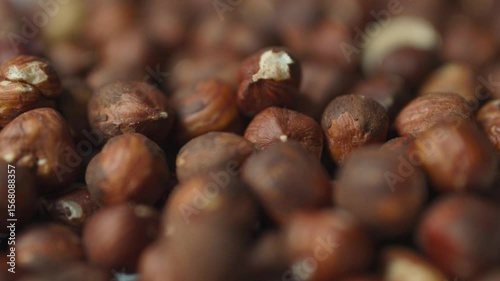 Close-up of raw peeled hazelnuts with smooth rotation motion