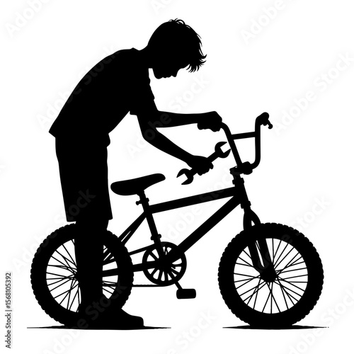 Boy fixing bike handlebars
