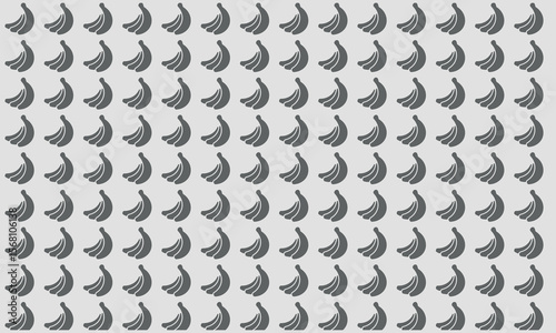 Banana Array Composition: An abstract composition showcasing a repeating pattern of ripe bananas on a uniform background.