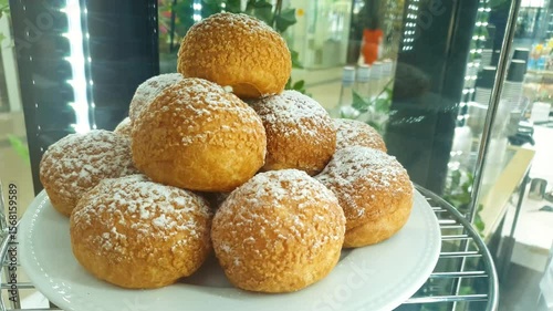 Custard cake, dessert bun Shu on display,flour product with cream, bakery.