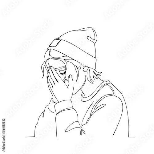 A person in a beanie with a sad mood crying