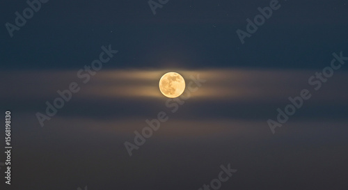 A radiant full moon illuminates the tranquil night sky above a mystical, abstract horizon.