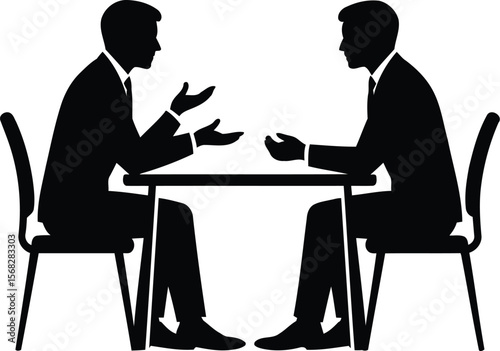 Silhouette of two businessmen discussing a deal during a corporate meeting or job interview.