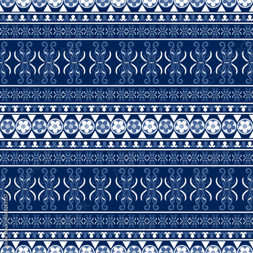 A seamless pattern featuring blue floral and wave motifs with oriental influences, ideal for textiles like home decor, fashion, and accessories