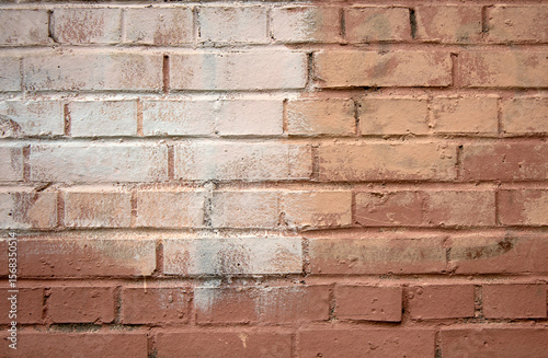 Background of old brick wall stained with white paint