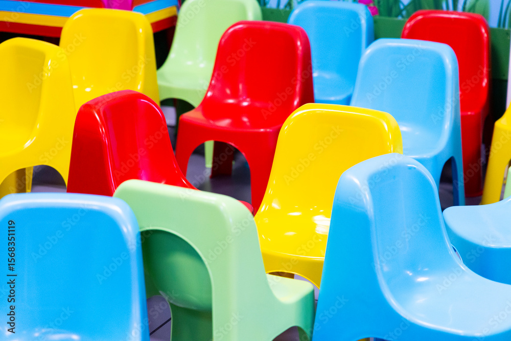 Fototapeta premium colored plastic chairs used in playrooms during children's parties