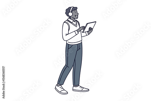 Man Walking and Using Tablet: A stylish man strolls while using a tablet and wearing headphones, showcasing a blend of modern technology and effortless style.