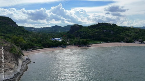 Wild tropical bay with mountains and soft water