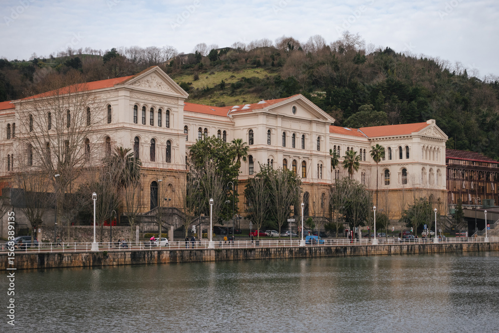 Naklejka premium Historic building of the University of Deusto facing the Bilbao estuary.