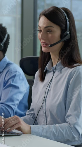 Three diverse business people multiethnic Indian women African man call center service operators work indoor office talking client headset on computer sales agents support sell online at callcenter