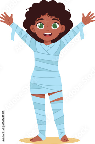Child dressed as mummy costume for Halloween celebration with arms raised happy expression 