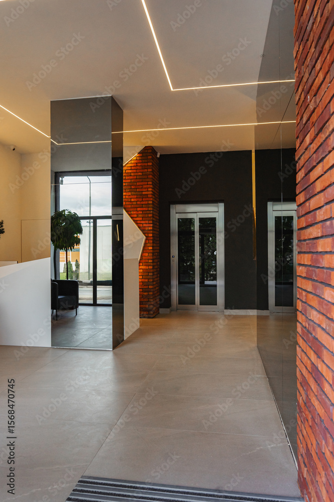 Obraz premium Interior of a building corridor with stairs and elevator