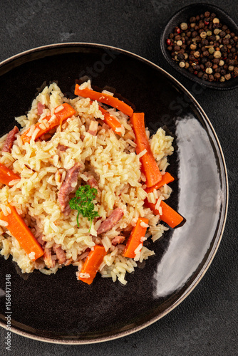 Rice meat and vegetables pilaf fresh delicious gourmet food background on the table rustic food top view copy space